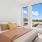 a bedroom with a large window