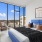 a bedroom with a large window