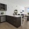 a kitchen with black cabinets